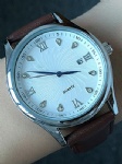 Brown leather strap watch with stone on dial