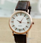 Gold case leather strap watch with UP index